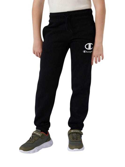 Pantalone Champion junior con elastico 307392 KK001 nero vista frontale con logo Champion e tasche laterali per bambini