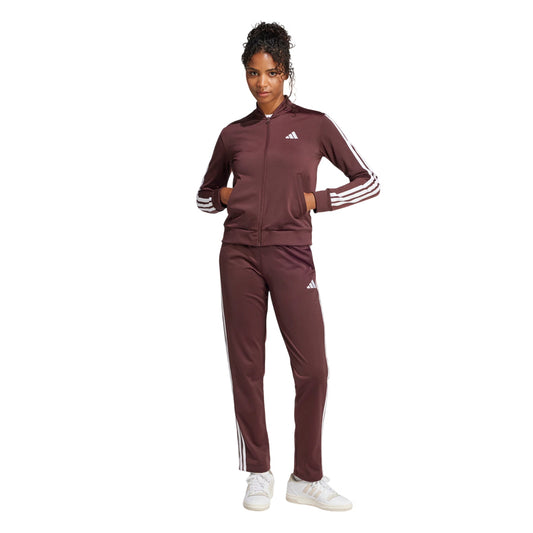 Tuta sportiva donna Adidas colore aurora rubino con zip frontale e iconiche 3-stripes, realizzata in tricot effetto seta da materiali riciclati